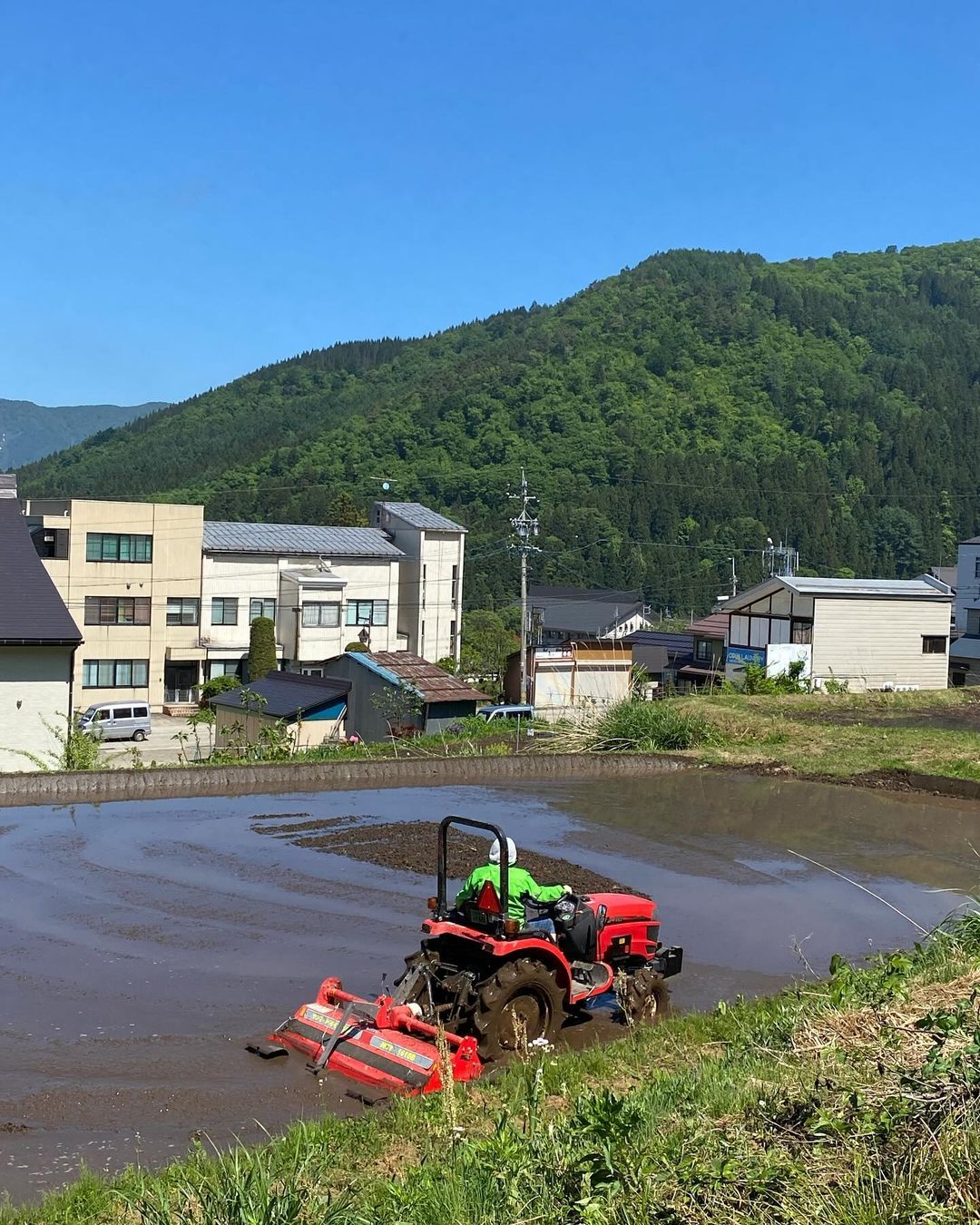 Nozawa Onsen's locals preparing their farm lands and rice fields for the green season