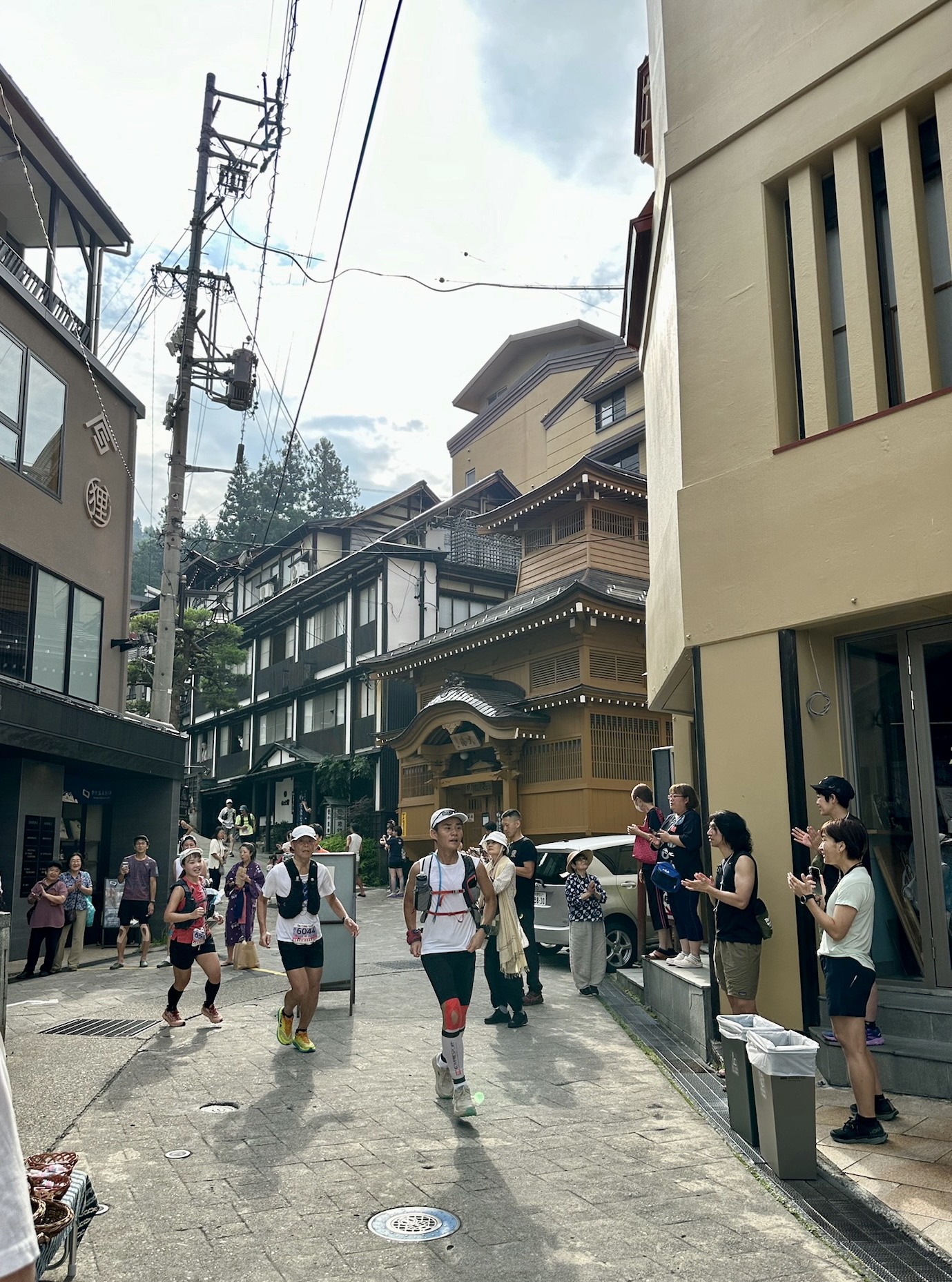 Runners sweeping through the streets of Nozawa Onsen 