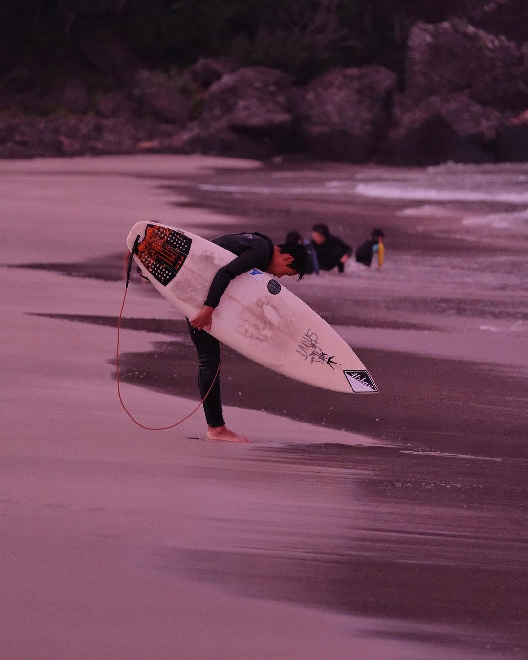 Shimoda local bowing to the ocean