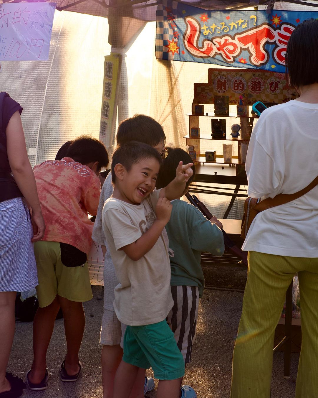 Stalls with food, drink and entertainment running along streets of Nakao 