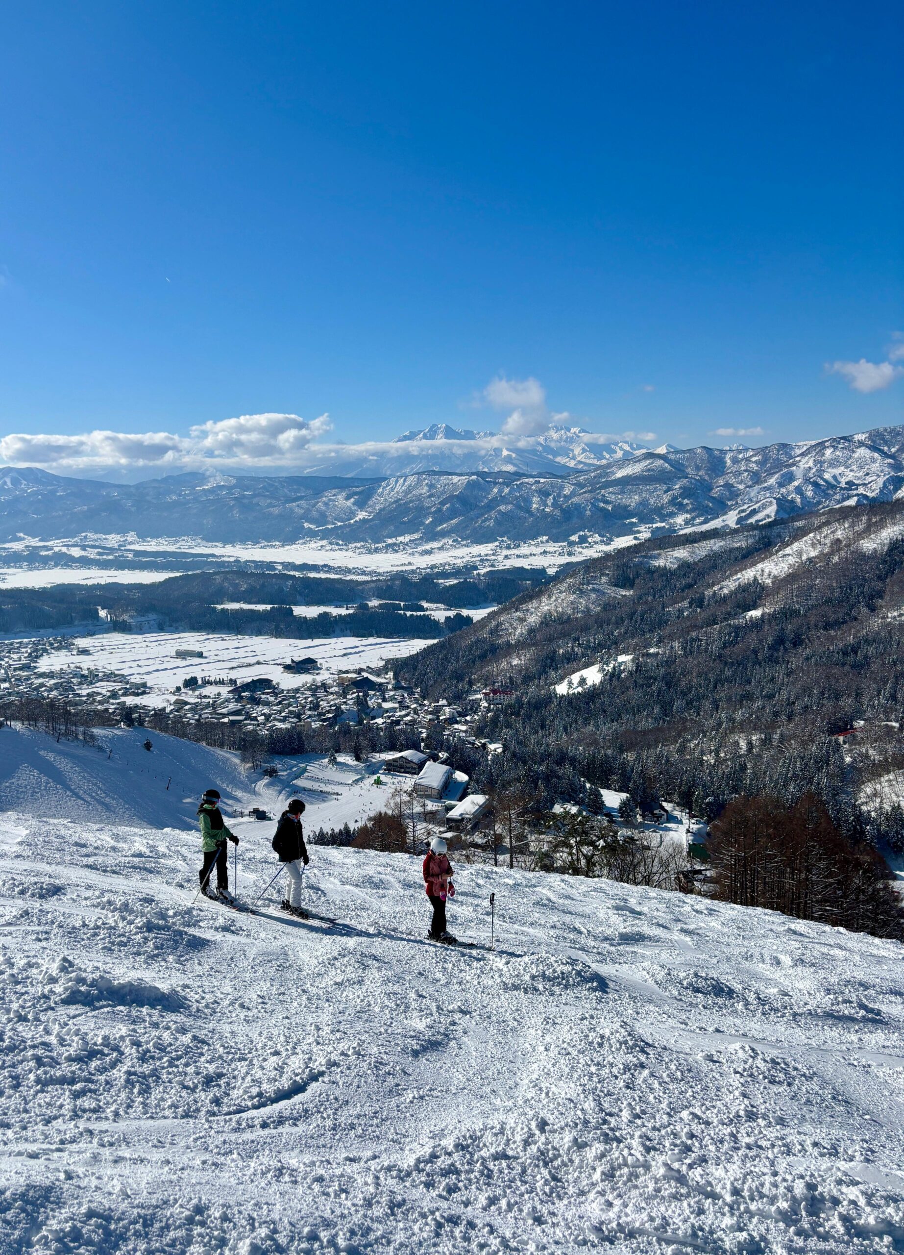 Myoko mountain is peaking its head through the thin layer of clouds in the distance 