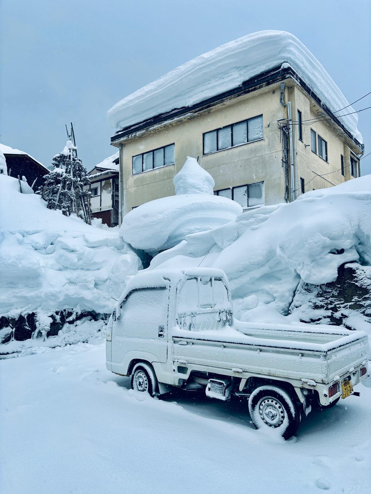 Cars and houses are shackled in ice and snow after recent snowstorms